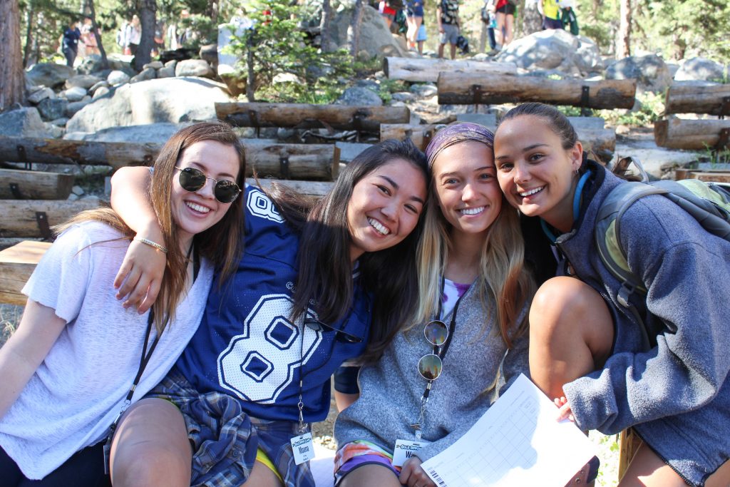 4 Summer camp staff smile for the camera at Gold Arrow Camp